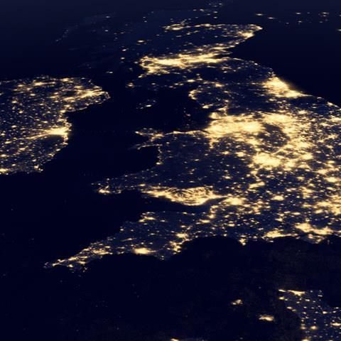 United Kingdom at night in the earth planet rotating from space