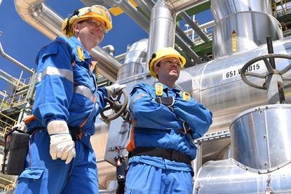 chemical industry plant - workers in work clothes