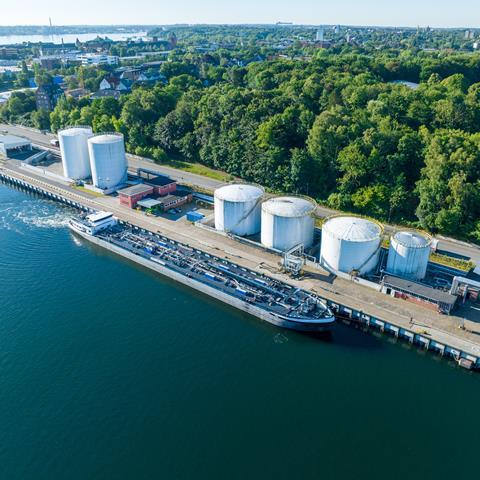 Aerial view of oil tankers moored at an oil storage silo termina